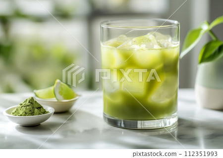 Matcha Margarita with ice and sprinkled with matcha powder in the kitchen on the table 112351993