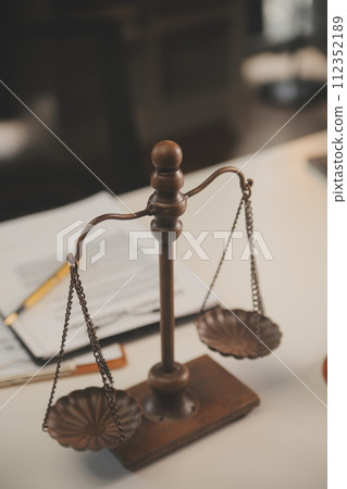 image of judge's hammer, scales lady of justice, law book, laptop computer and contract documents with pen concept of law and justice. 112352189
