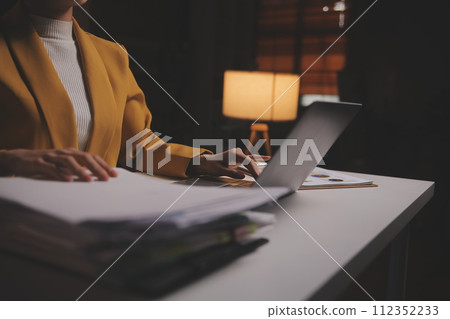 Business woman using calculator for do math finance on wooden desk in office and business working background, tax, accounting, statistics and analytic research concept Business woman using calculator for do math finance on wooden desk in office and business working background, tax, accounting, statistics and analytic research concept 112352233