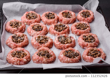 Delicious baked meat boats with mushrooms, cheese, salt and spices 112352426