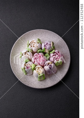 Beautiful tasty marshmallows in the form of tulip buds Beautiful tasty marshmallows in the form of tulip buds 112352488