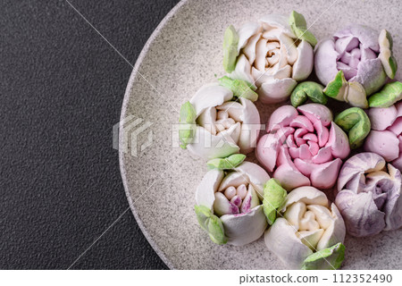 Beautiful tasty marshmallows in the form of tulip buds Beautiful tasty marshmallows in the form of tulip buds 112352490