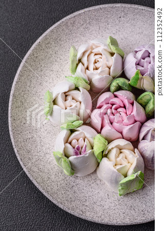 Beautiful tasty marshmallows in the form of tulip buds Beautiful tasty marshmallows in the form of tulip buds 112352492