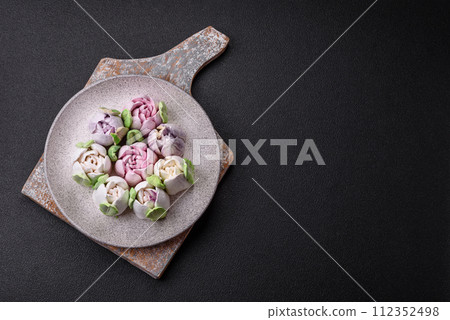 Beautiful tasty marshmallows in the form of tulip buds 112352498