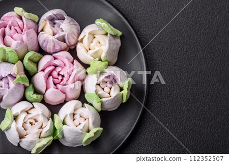 Beautiful tasty marshmallows in the form of tulip buds 112352507