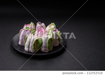 Beautiful tasty marshmallows in the form of tulip buds Beautiful tasty marshmallows in the form of tulip buds 112352510