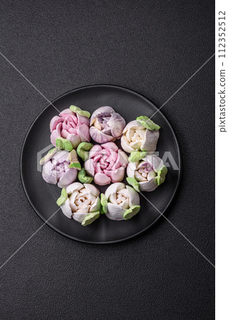 Beautiful tasty marshmallows in the form of tulip buds Beautiful tasty marshmallows in the form of tulip buds 112352512