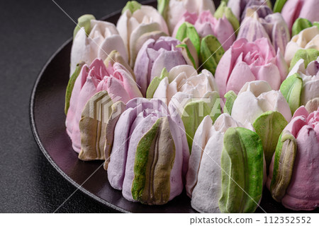 Beautiful tasty marshmallows in the form of tulip buds Beautiful tasty marshmallows in the form of tulip buds 112352552