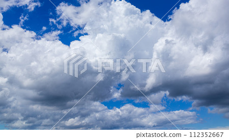 Many clouds flowing in the summer blue sky 112352667