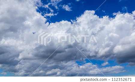 Many clouds flowing in the summer blue sky 112352671