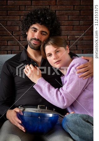 Cozy Couple Enjoying a Movie Night Cozy Couple Enjoying a Movie Night 112353575