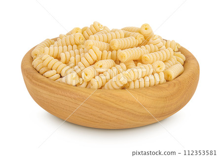 Italian spiral shaped pasta, Fusilli bucati macaroni in wooden bowl, isolated on white background 112353581