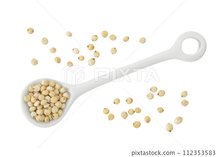 Sorghum seeds in ceramic spoon isolated on white background. Top view. Flat lay. Sorghum seeds in ceramic spoon isolated on white background. Top view. Flat lay. 112353583