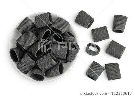 Black pasta with cuttlefish ink in ceramic bowl isolated on white background. Top view. Flat lay Black pasta with cuttlefish ink in ceramic bowl isolated on white background. Top view. Flat lay 112353613