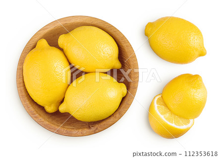 Ripe lemons in wooden bowl isolated on white background. Top view. Flat lay. 112353618