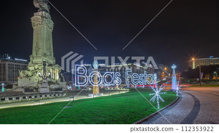 Panorama showing the Marques de Pombal square with monument and Christmas lights night timelapse. Lisbon, Portugal 112353922
