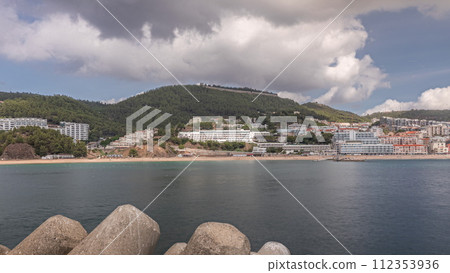 Panorama showing view of Sesimbra Town and Port timelapse, Portugal. Panorama showing view of Sesimbra Town and Port timelapse, Portugal. 112353936
