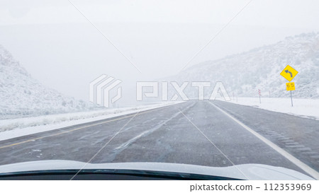POV-Electric vehicle is captured deftly navigating the I-70 highway during a winter storm in Western Colorado. POV-Electric vehicle is captured deftly navigating the I-70 highway during a winter storm in Western Colorado. 112353969