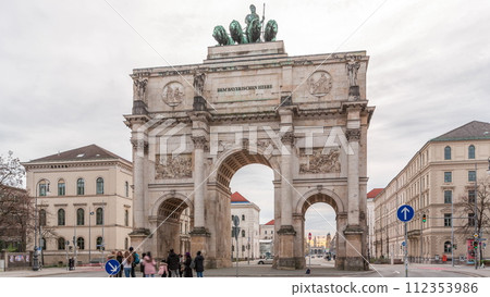 The Siegestor or Victory Gate in Munich is a memorial arch, crowned with a statue of Bavaria with a lion quadriga timelapse. Germany The Siegestor or Victory Gate in Munich is a memorial arch, crowned with a statue of Bavaria with a lion quadriga timelapse. Germany 112353986