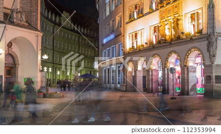 Kaufingerstrasse, shopping street and pedestrian zone in Munich downtown near the Marienplatz night timelapse. Bavaria, Germany 112353994