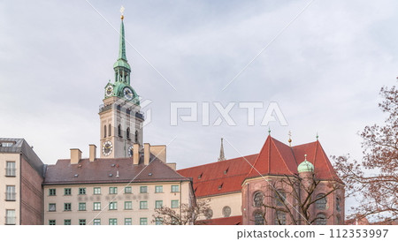 St. Peter's Church Peterskirche clock tower along Viktualienmarkt market street timelapse in Munich, Bavaria, Germany. St. Peter's Church Peterskirche clock tower along Viktualienmarkt market street timelapse in Munich, Bavaria, Germany. 112353997