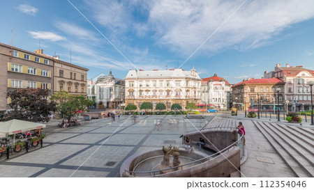 Panorama showing Sulkowski Castle and fountain on Chrobry Square in Bielsko-Biala timelapse, Poland. 112354046