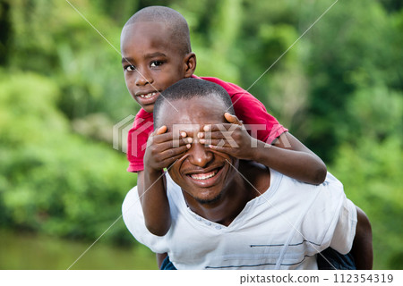 Happy young father and happy son having fun and enjoying the fre Happy young father and happy son having fun and enjoying the fre 112354319