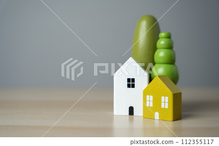 Cute figurines of houses and trees. Buy a nice house. Mortgage loan. Affordable housing. Housing search and realtor services 112355117