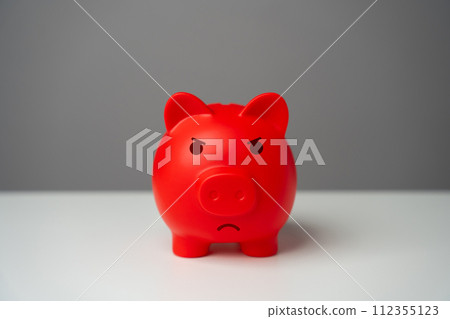Angry red inflated piggy bank. Overheated financial market. Difficult economic conditions. Threat to savings. Heavy burden on the budget, high expenses and the likelihood of bankruptcy. 112355123