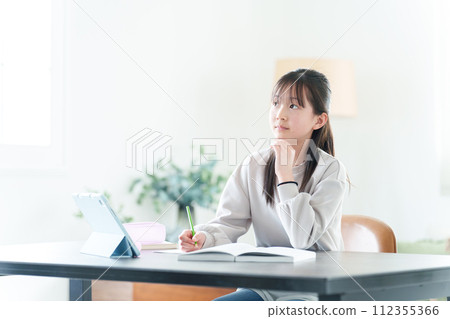 girl thinking while studying girl thinking while studying 112355366