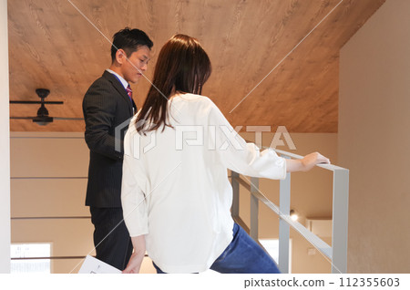 A man and a woman giving real estate information A man and a woman giving real estate information 112355603