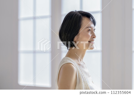 Early 50s woman profile beauty image portrait 112355604