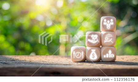 Employee benefits concept, Wooden block on desk with employee benefits icon on virtual screen. 112356176