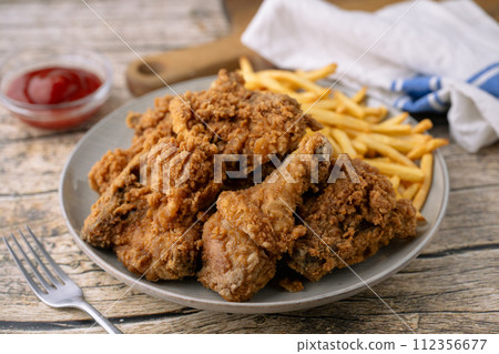 fried chicken with french fries 112356677