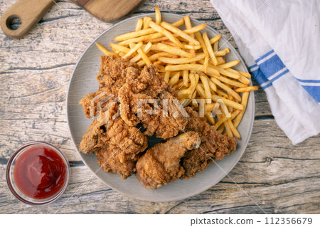 fried chicken with french fries 112356679