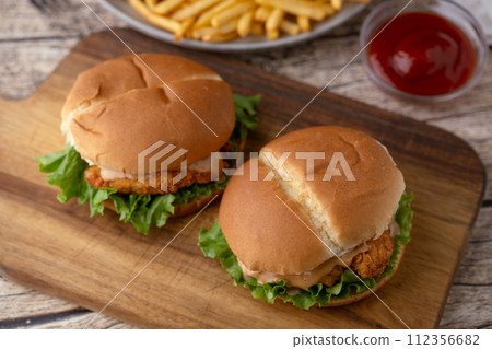 fried chicken sandwich with french fries fried chicken sandwich with french fries 112356682
