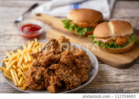 fried chicken, chicken sandwich and fries fried chicken, chicken sandwich and fries 112356683