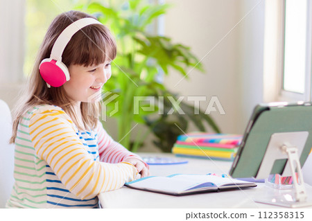 Online remote learning. School kids with computer. 112358315