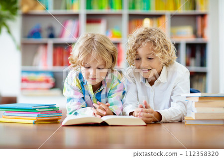 Child reading book. Kids read. School education. 112358320