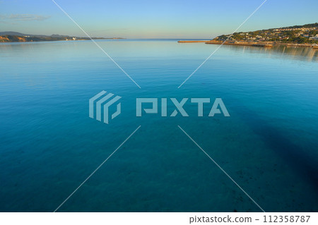 Nakijin Village, Kunigami District, Okinawa Prefecture/Nago City, Kouri Blue Sea in the morning seen from Kouri Ohashi Bridge, which connects Okinawa Main Island and Kouri Island 112358787