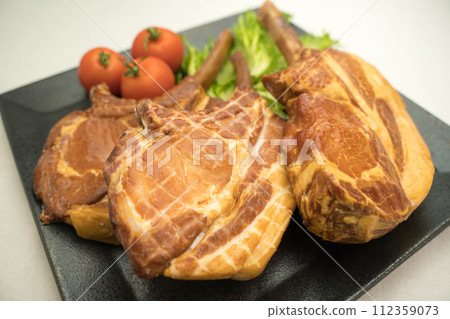 Roasted ham with bones 112359073