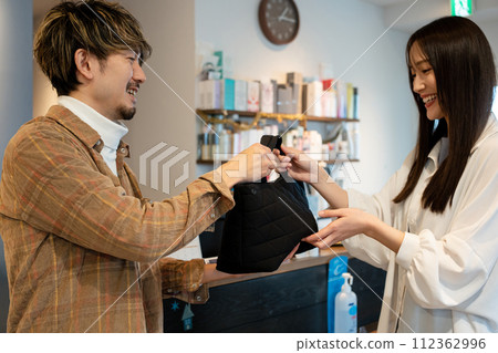 Customers leaving their luggage at the beauty salon 112362996