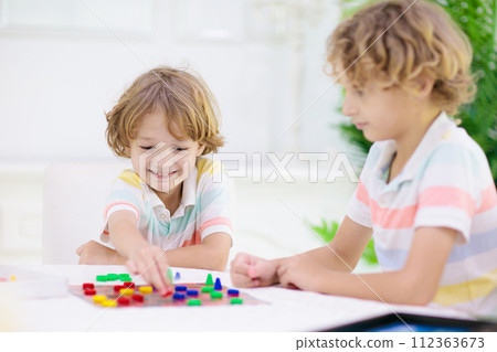 Family playing board game. Kids play. 112363673
