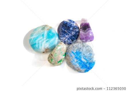 Various colorful healing stones, white background 112365030