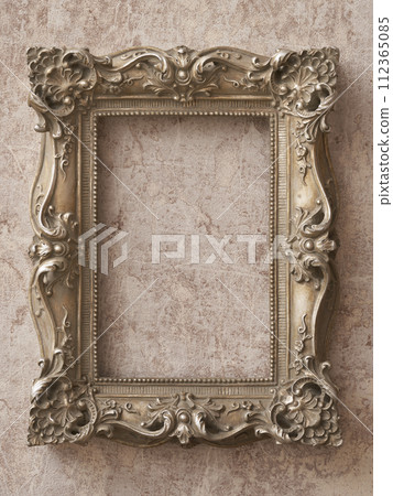 Antique picture frame hanging on marble background 112365085