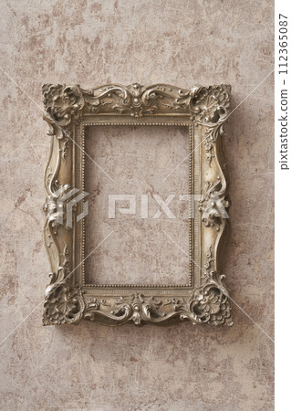 Antique picture frame hanging on marble background 112365087