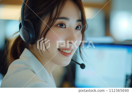 "AI-generated image" of a young female operator wearing a headset in the office 112365690