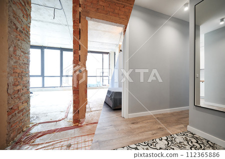 Living room and bedroom with large windows and doors before and after refurbishment or restoration. Old apartment before renovation and new renovated flat with parquet floor and furniture. 112365886