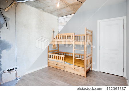 Comparison of children room with wooden bunk bed before and after restoration. Old apartment room with brick wall and new renovated flat with parquet floor and kid house bed. Comparison of children room with wooden bunk bed before and after restoration. Old apartment room with brick wall and new renovated flat with parquet floor and kid house bed. 112365887