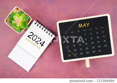 Calendar for May 2024 in black chalkboard on red background. 112366894